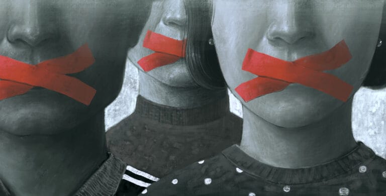 Article headline: Calls to tackle "abuse" lawsuits designed to block freedom of expression Image description: Artistic depiction of individuals with their mouths covered by red tape, conveying themes of oppression, restricted speech, or lack of freedom.