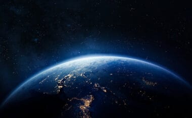 Article headline: Who runs Scotland's space industry? Image description: Nightly Earth in the outer space. Abstract wallpaper. City lights on planet. Civilization. Elements of this image furnished by NASA (url: https://eoimages.gsfc.nasa.gov/images/imagerecords/79000/79765/dnb_land_ocean_ice.2012.3600x1800.jpg)