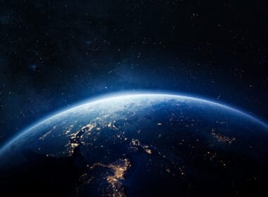 Article headline: Who runs Scotland's space industry? Image description: Nightly Earth in the outer space. Abstract wallpaper. City lights on planet. Civilization. Elements of this image furnished by NASA (url: https://eoimages.gsfc.nasa.gov/images/imagerecords/79000/79765/dnb_land_ocean_ice.2012.3600x1800.jpg)