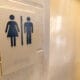 Headlineç Scots charity in trans rights row after announcing change to bathroom access Image description: Unisex Bathroom sign with both male and female symbols, with copy space.