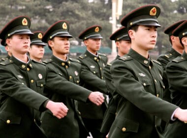 Beijing, China. March 29th, 2013. A group of Chinese military marching across Tiananmen Square.