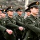 Beijing, China. March 29th, 2013. A group of Chinese military marching across Tiananmen Square.