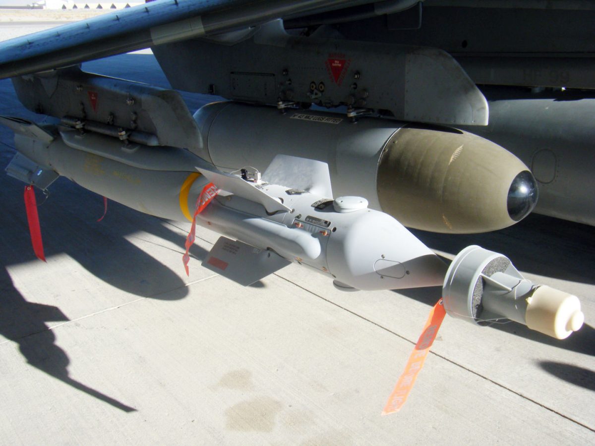 A Paveway IV laser guided bomb beneath a Harrier GR9.