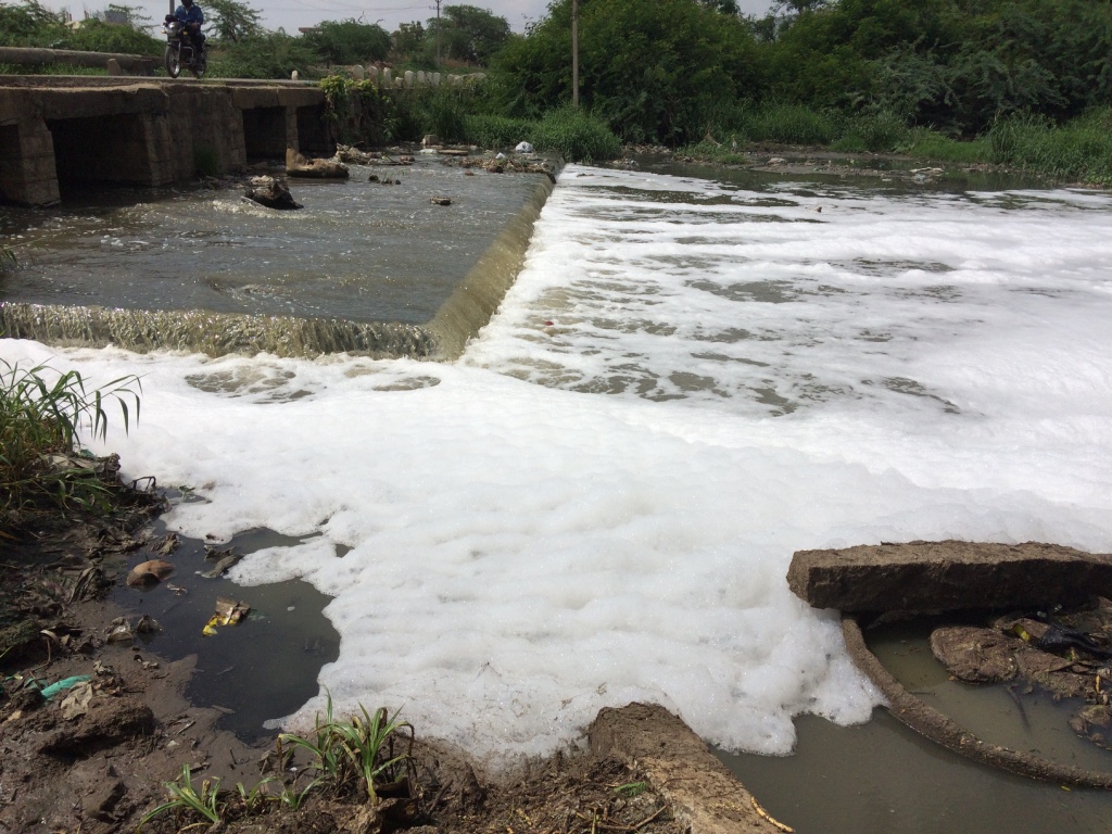 Effluent-floating-on-the-surface-of-the-Chinna-Vagu-River-downstream-of-the-Patancheru-Bollarum-Industrial-Cluster-in-Hyderabad