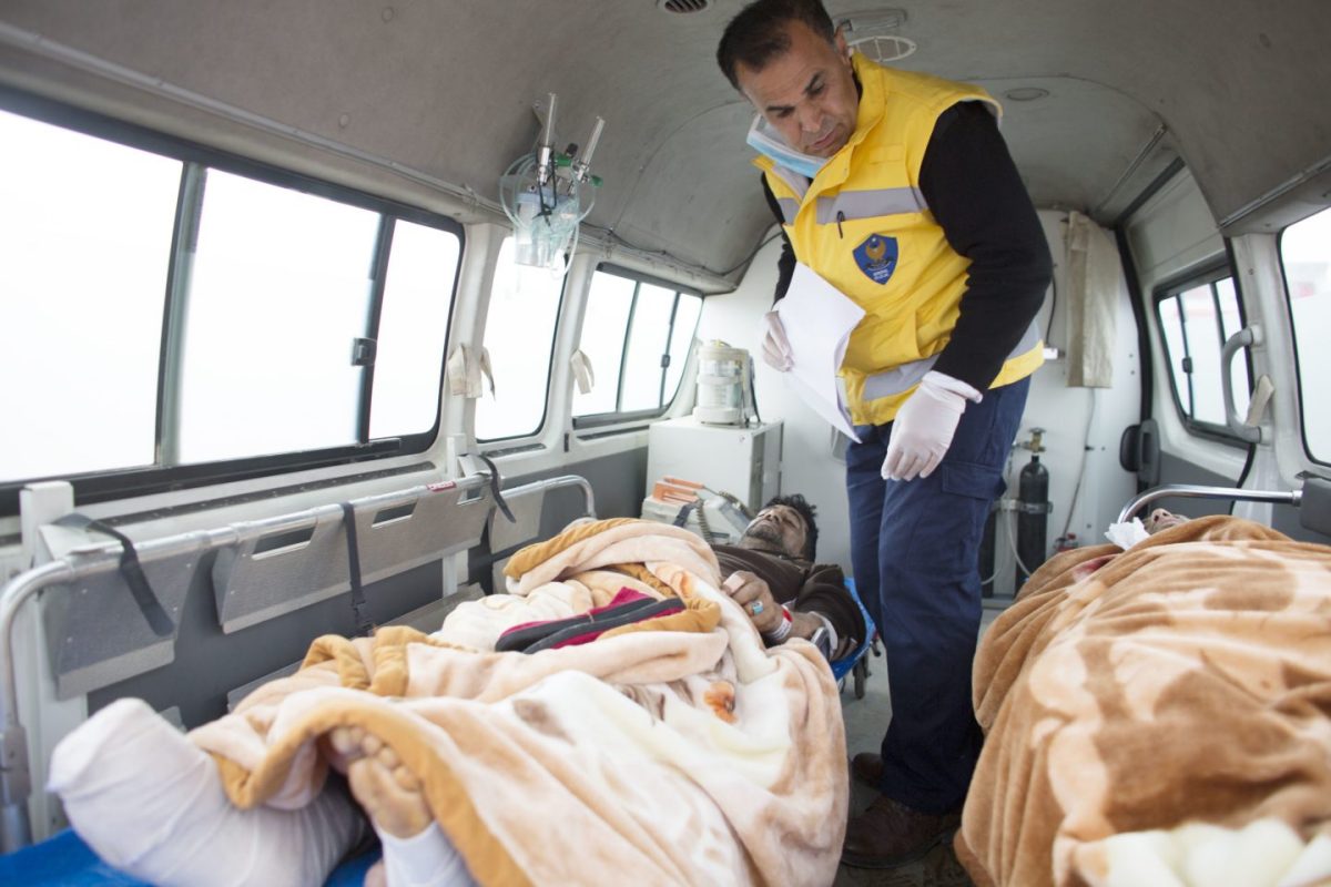 Kurdish medics and injured Mosul residents in ambulance Kurdish medics and injured Mosul residents in ambulance