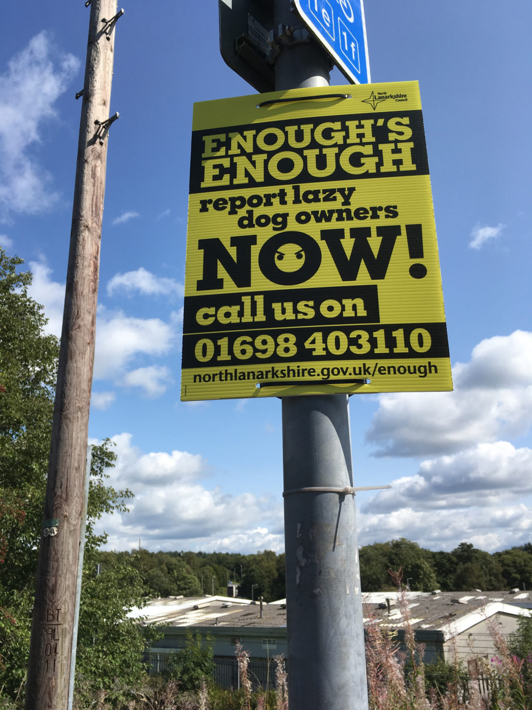 Report Lazy Dog Owners Now sign