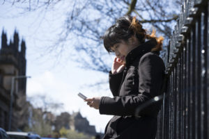 Young women on phone in Edinburgh