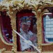 King Charles in a ceremonial carriage at his coronation