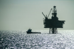 oil rig silhouetted in daytime