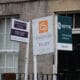 Letting agent signs advertising rental properties